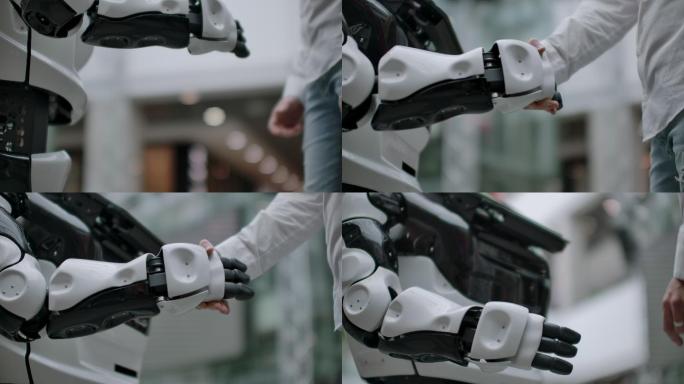 一个商人和一个机器人握手的手