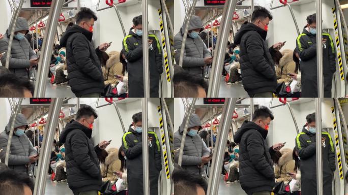 地铁列车车厢里的低头族沉浸式玩手机