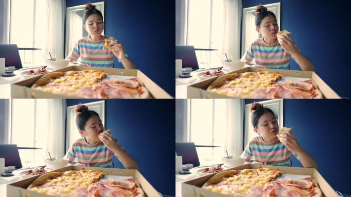 少女在家吃披萨。美食传统特色
