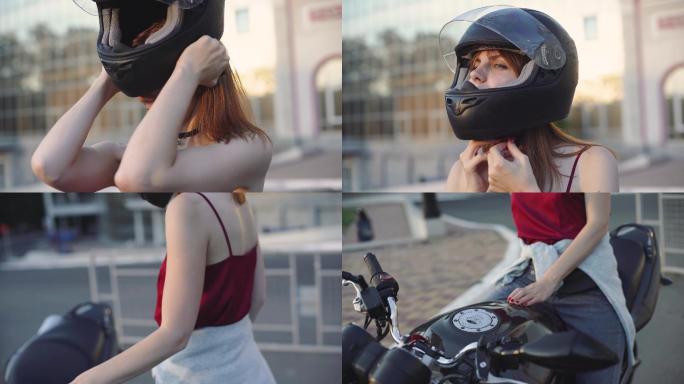 年轻漂亮的女摩托车手戴着黑色头盔。