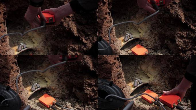 工人将仪表连接到精确的地震传感器上