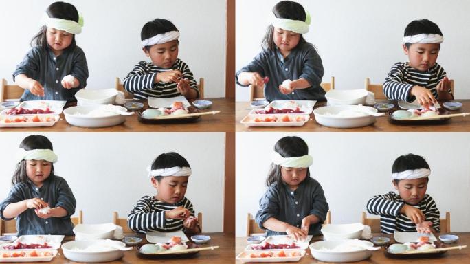 做寿司的小孩子日本小朋友做饭团