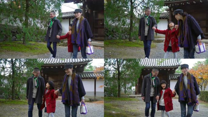 一家人在日本寺庙花园里散步