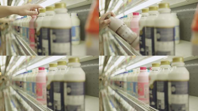 从超市货架上挑选牛奶