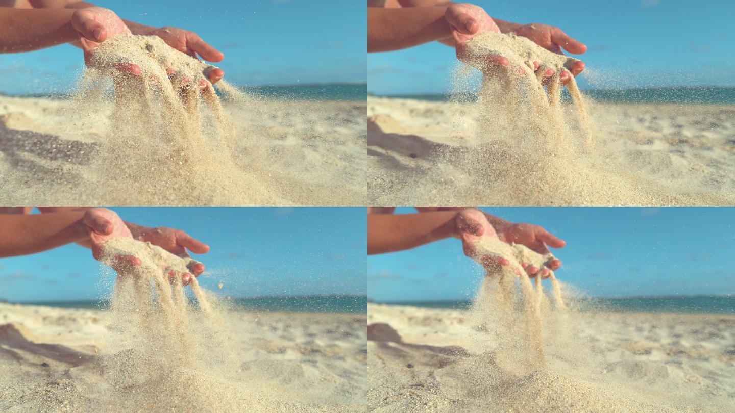 柔和的夏日微风拂去女孩双手上的沙子。
