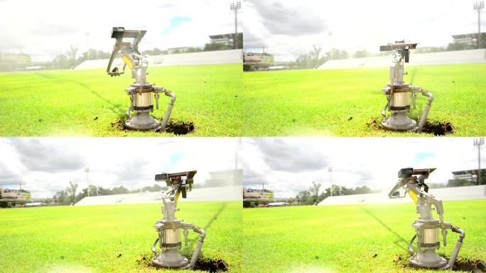 体育场里的洒水器草坪浇水自动维护草地自动