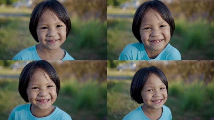 小女孩微笑着看着镜头。