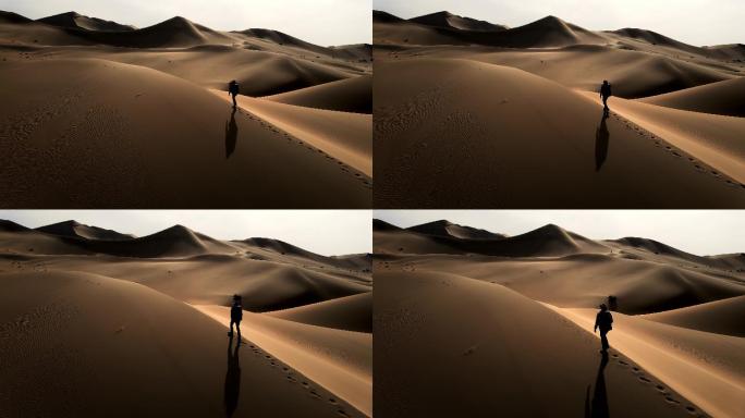 人在沙漠中走航拍