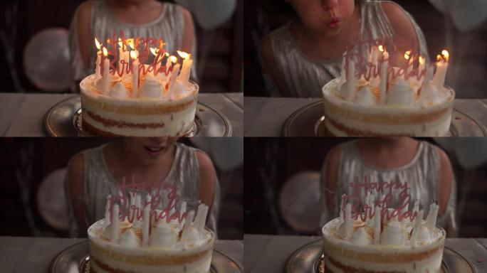 女孩在生日时许愿吹蜡烛小寿星生日快乐