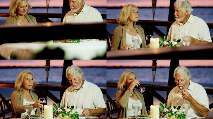 快乐的老年夫妇在海滨酒店用餐