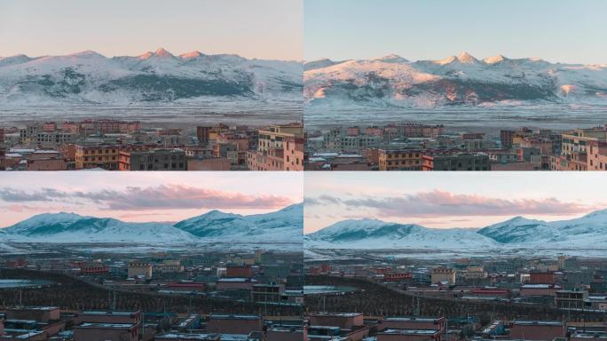 理塘县城雪山雪景日出延时摄影