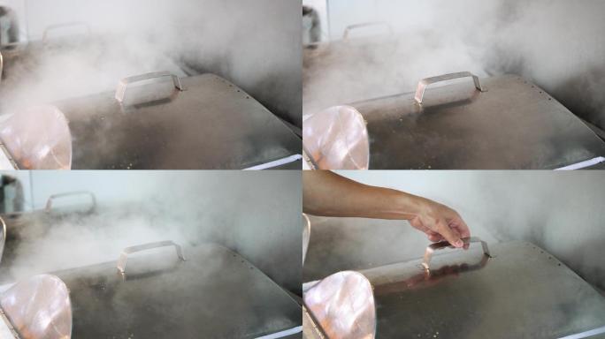 广东肠粉店的厨房里蒸汽升腾的肠粉炉，升格