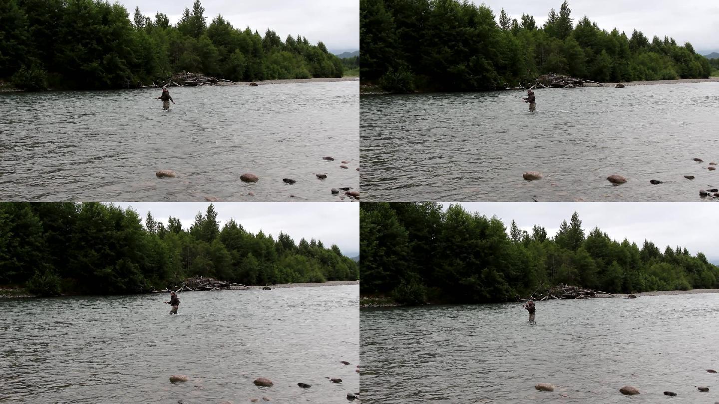 河上的男子河边垂钓休闲活动钓竿钓鱼