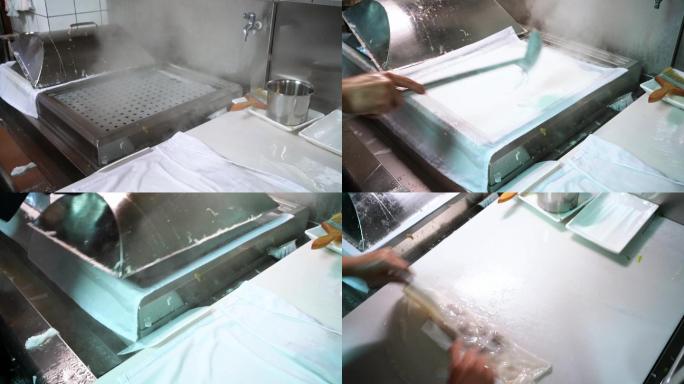 广东肠粉店的厨房里厨师在制作肠粉