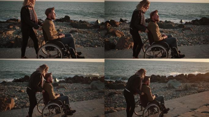 照顾残疾丈夫并陪他在海边散步的女人