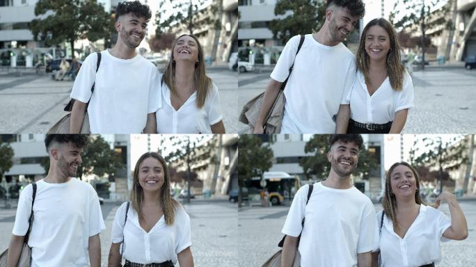 幸福的年轻夫妇走在街上的正视图