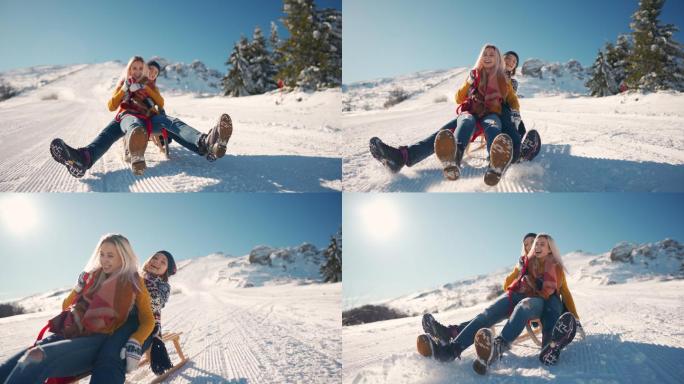 两个微笑的女孩一起滑下雪山