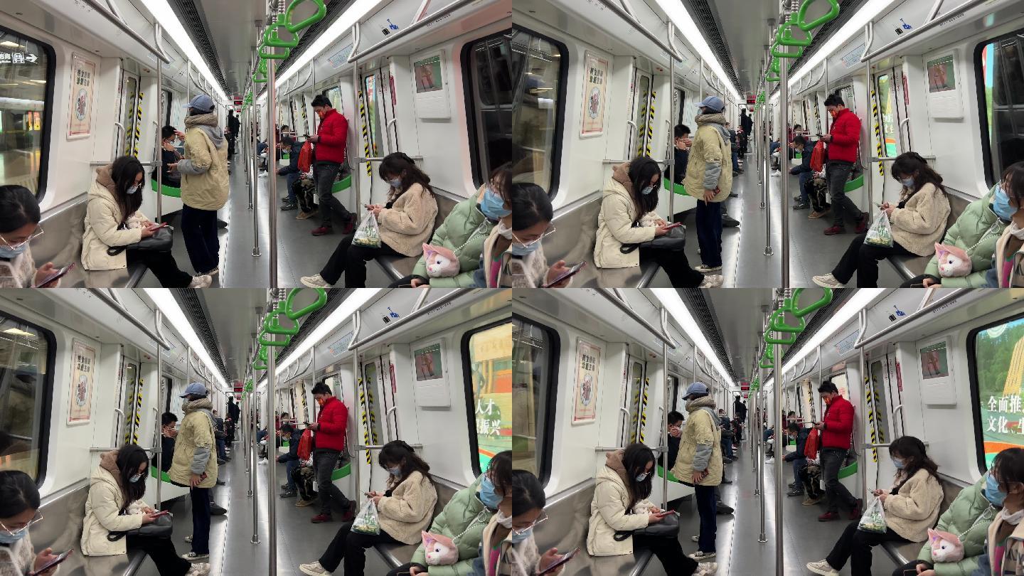 南宁地铁列车减速进站列车车厢里的乘客人群