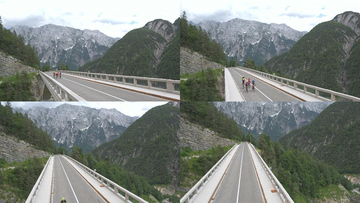 一群公路自行车手骑在高架桥上