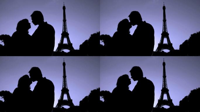 巴黎埃菲尔铁塔前亲吻的情侣