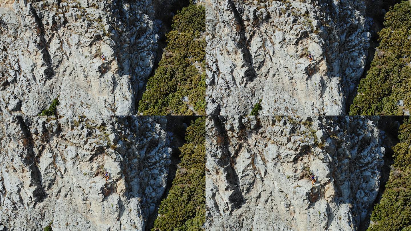 攀岩运动员正在攀登山顶的鸟瞰图