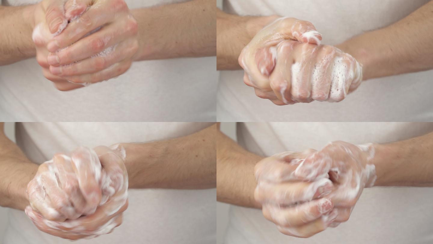 男子用肥皂洗手。洗手消毒