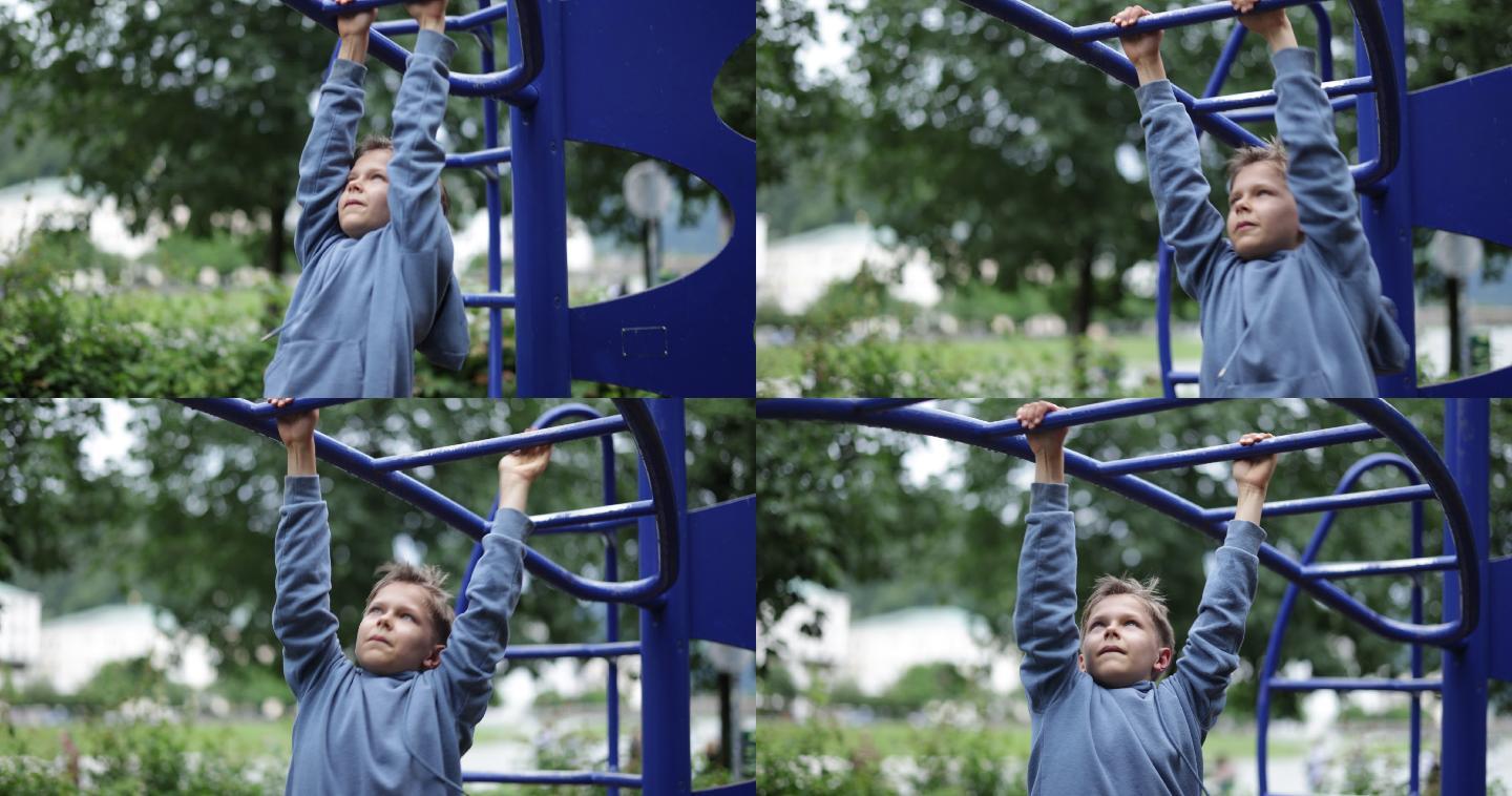 公园玩耍的小男孩小男孩攀爬体力不支体能锻