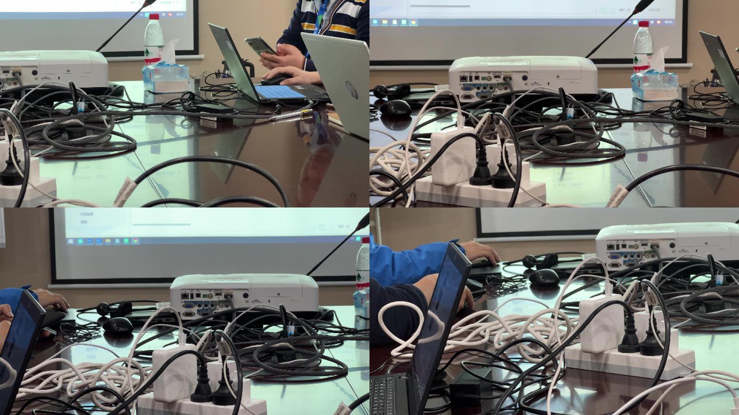 杂乱的会议室桌面投影仪笔记本电线电缆网线