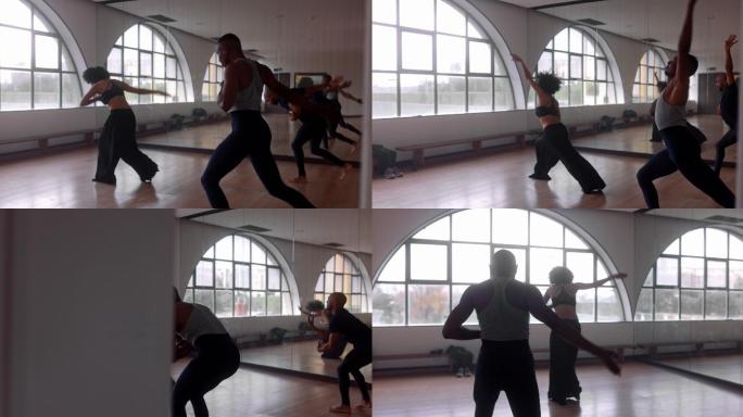教师和学生在工作室练习当代舞蹈
