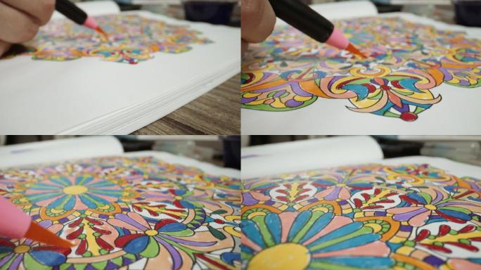 水基笔轻轻地应用多种颜色的曼荼罗绘图。