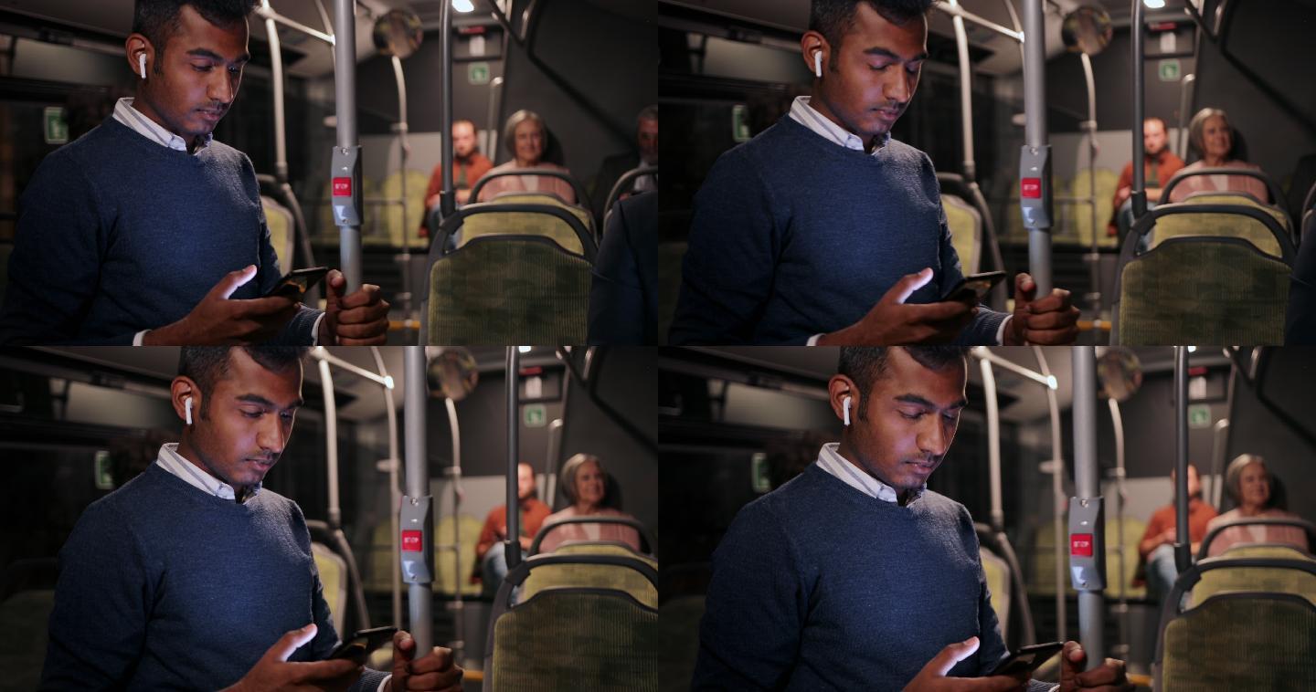 商人在公交车上使用智能手机