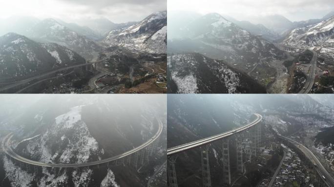 雪景中的雅西高速干海子大桥螺旋隧道航拍