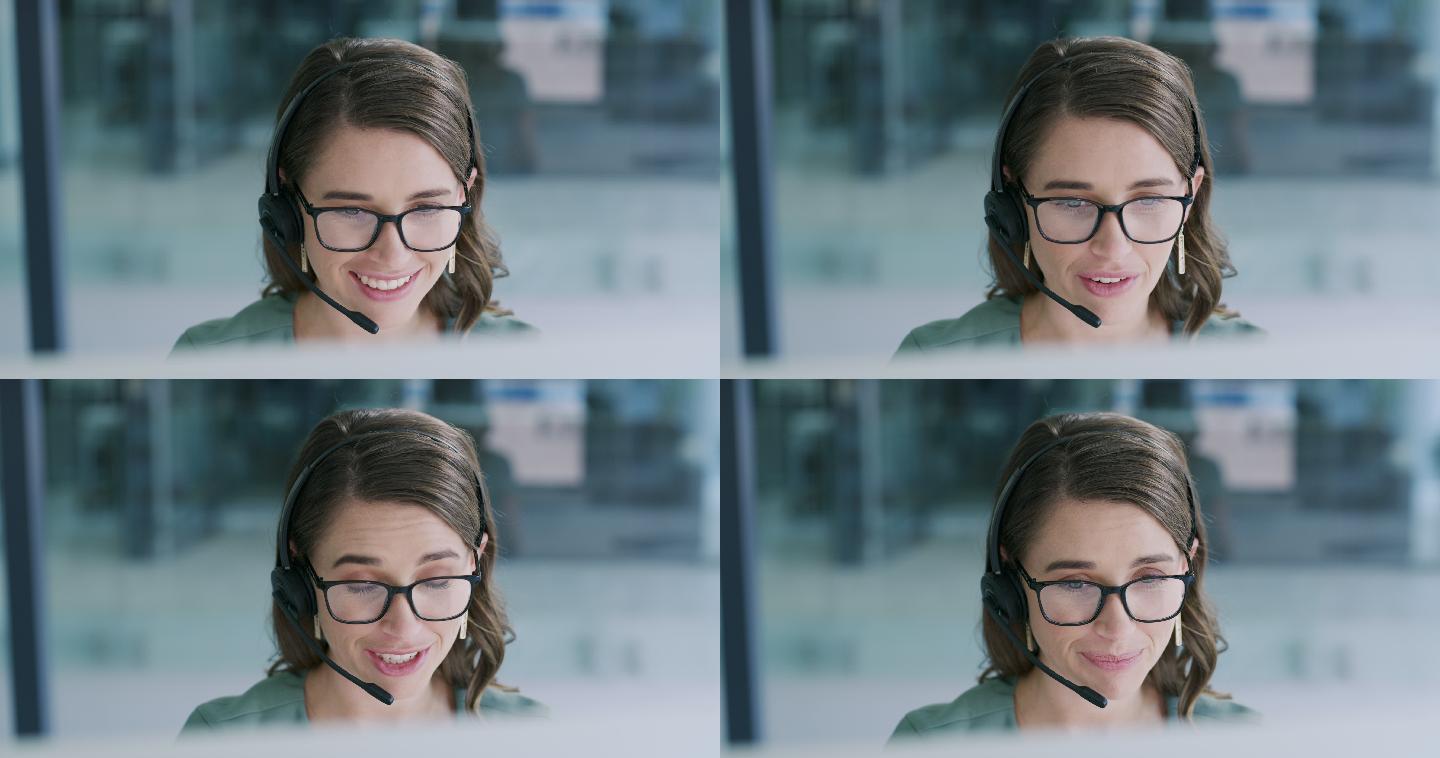 一名年轻女子在现代办公室使用耳机和电脑