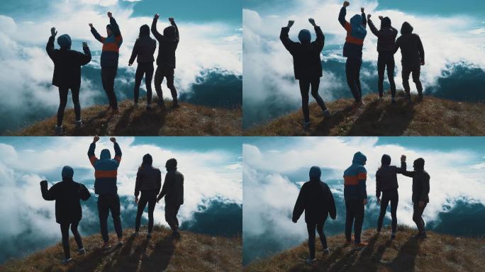 四个快乐的人站在山上