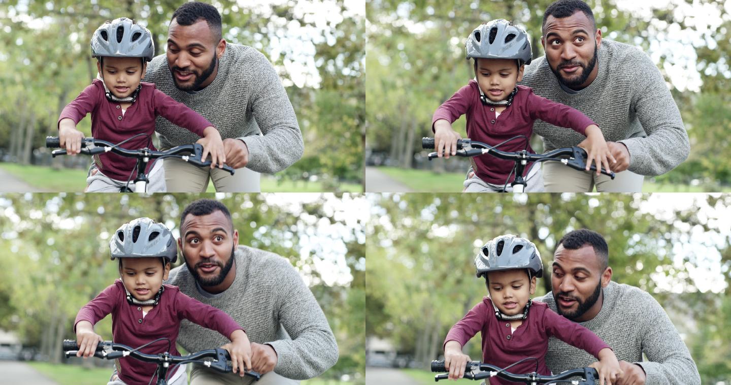男子教儿子骑自行车