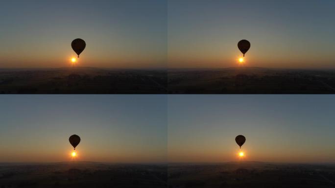 在一个薄雾蒙蒙的早晨，热气球升起