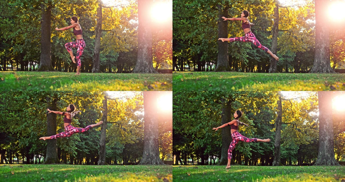 年轻女子在阳光公园做跳跃劈叉