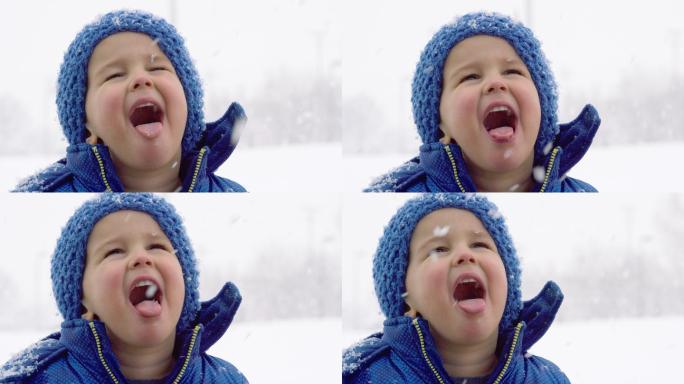 男孩穿着冬装捕捉雪花