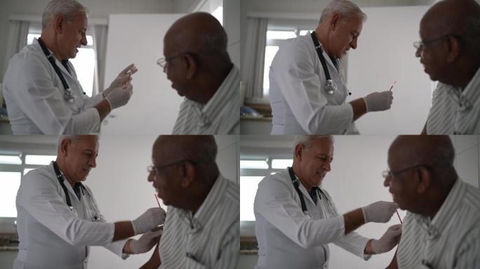 医生给一位老年患者注射疫苗
