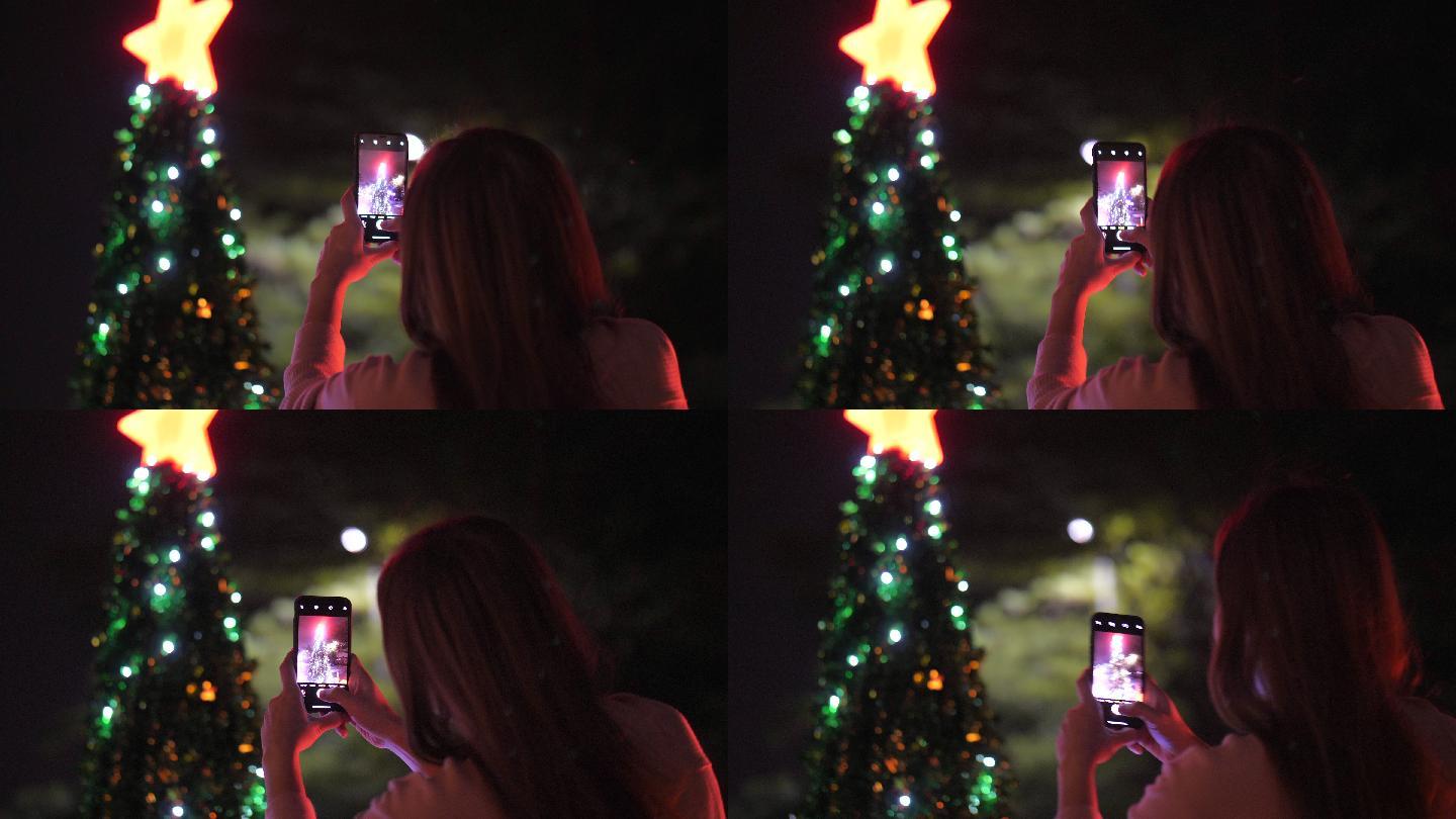 拍摄圣诞树的女子圣诞节国外新年美国过年