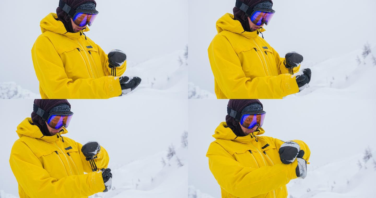 滑雪运动员重新调整他的手套