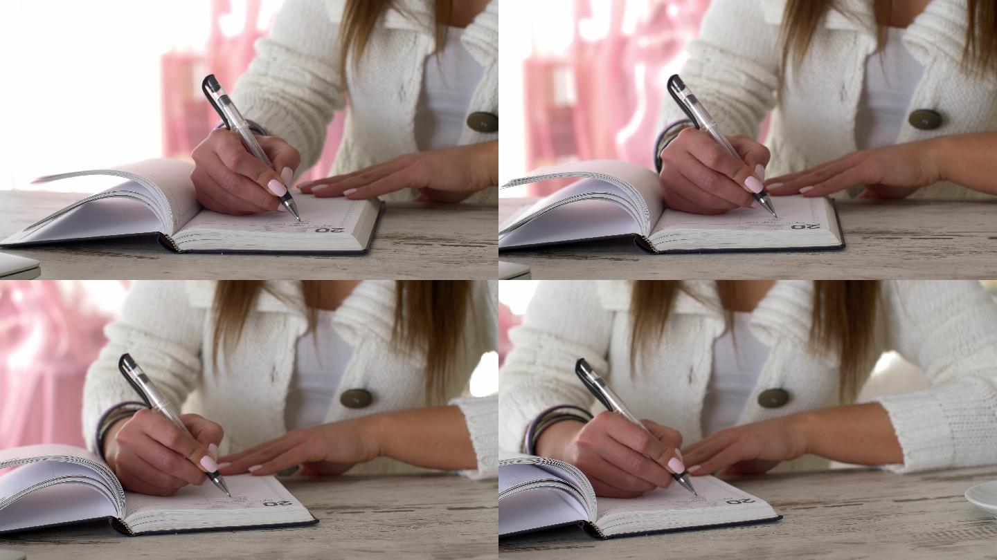 年轻女性在日记中写下待办事项