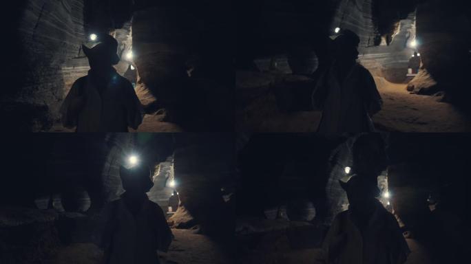 一位探索洞穴的女性游客