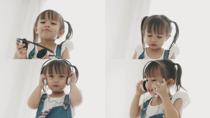 可爱的小女孩正在听音乐