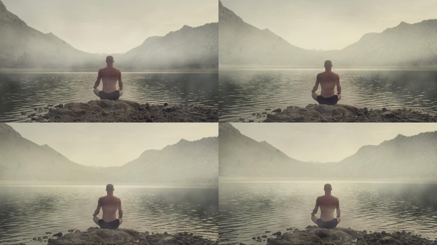 一个男人在湖边练习瑜伽