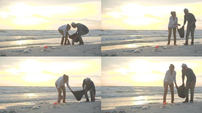 清理海边垃圾的夫妇