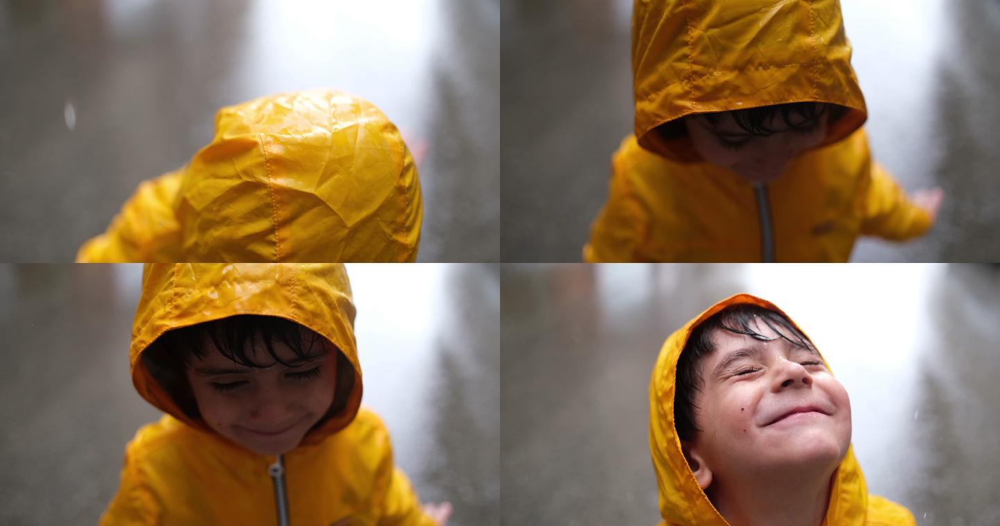 可爱的小男孩在雨天玩耍
