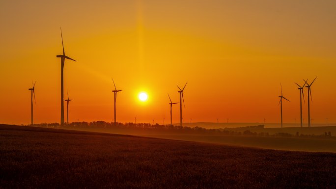 风力涡轮机日出朝阳低碳减排清洁能源