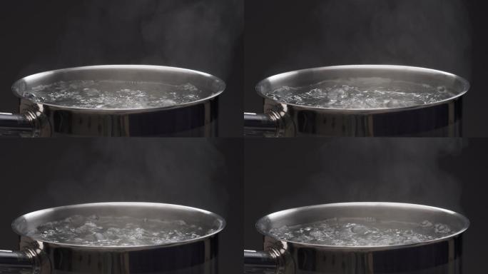 锅里煮沸的水烧热水玻璃水壶开水