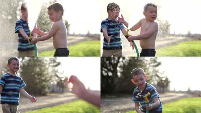 两个小男孩玩水婴儿亲子互动陪伴家庭温馨聚
